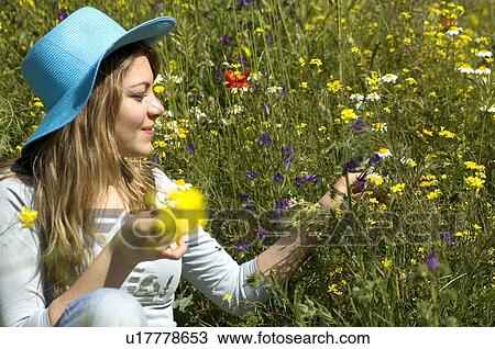 Stock Image - Woman, Young, Nature, Country, Flowers, Country of flowers, Yellow. Fotosearch