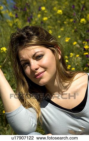 Stock Image - Woman, Young, Nature, Country, Flowers, Country of flowers, Yellow. Fotosearch