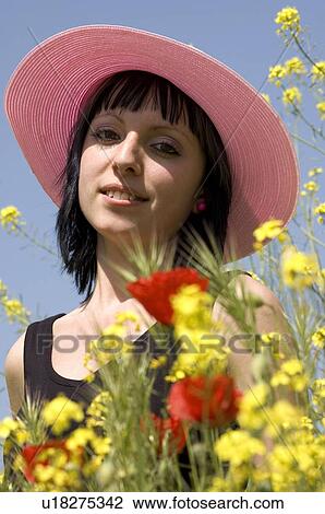 Stock Image - Woman, Young, Nature, Country, Flowers, Country of flowers, Yellow. Fotosearch