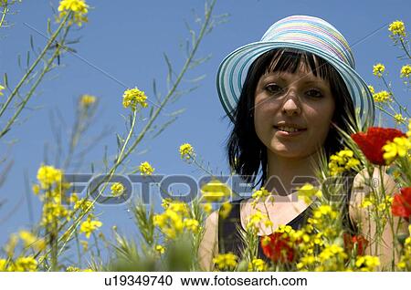 Stock Image - Woman, Young, Nature, Country, Flowers, Country of flowers, Yellow. Fotosearch