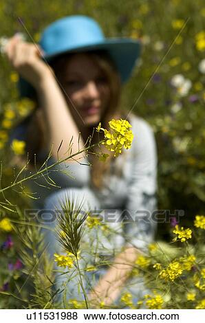 Stock Photo - Woman, Young, Nature, Country, Flowers, Country of flowers, Yellow. Fotosearch