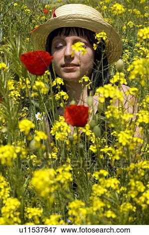 Stock Photo - Woman, Young, Nature, Country, Flowers, Country of flowers, Yellow. Fotosearch
