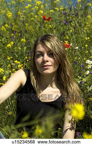 Woman, Young, Nature, Country, Flowers, Country of flowers, Yellow View Large Photo Image Stock Photo - Woman, Young, Nature, Country, Flowers, Country of flowers, Yellow. Fotosearch
