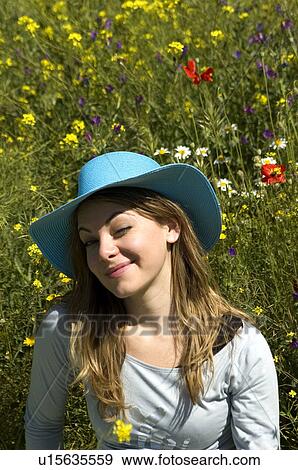 Stock Photo - Woman, Young, Nature, Country, Flowers, Country of flowers, Yellow. Fotosearch