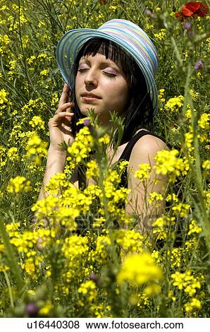 Stock Photo - Woman, Young, Nature, Country, Flowers, Country of flowers, Yellow. Fotosearch