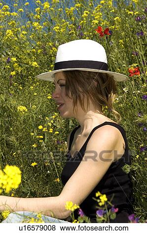 Stock Photo - Woman, Young, Nature, Country, Flowers, Country of flowers, Yellow. Fotosearch