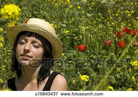 Stock Photo - Woman, Young, Nature, Country, Flowers, Country of flowers, Yellow. Fotosearch