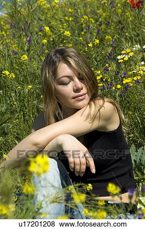 Woman, Young, Nature, Country, Flowers, Country of flowers, Yellow View Large Photo Image Stock Photo - Woman, Young, Nature, Country, Flowers, Country of flowers, Yellow. Fotosearch