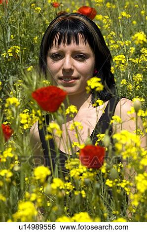 Woman, Young, Nature, Country, Flowers, Country of flowers, Yellow View Large Photo Image Stock Photograph - Woman, Young, Nature, Country, Flowers, Country of flowers, Yellow. Fotosearch
