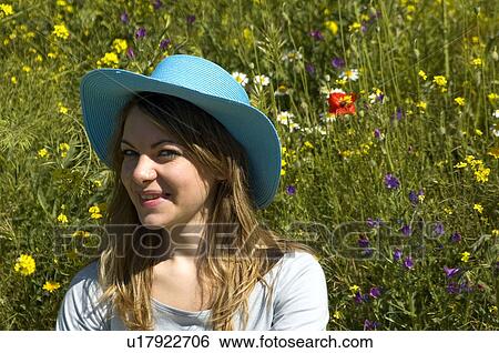 Stock Photograph - Woman, Young, Nature, Country, Flowers, Country of flowers, Yellow. Fotosearch