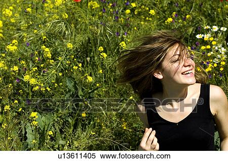 Stock Photography - Woman, Young, Nature, Country, Flowers, Country of flowers, Yellow. Fotosearch