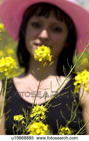 Stock Photography - Woman, Young, Nature, Country, Flowers, Country of flowers, Yellow. Fotosearch