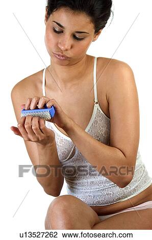 Stock Image - Woman, Beauty, Bodycare, Black hair, Long hair, Knickers. Fotosearch