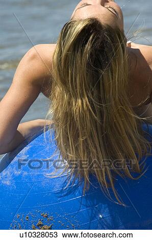 Stock Image - Woman, Blond, Blonde, Blond hair, Beauty, Beach, Summer. Fotosearch