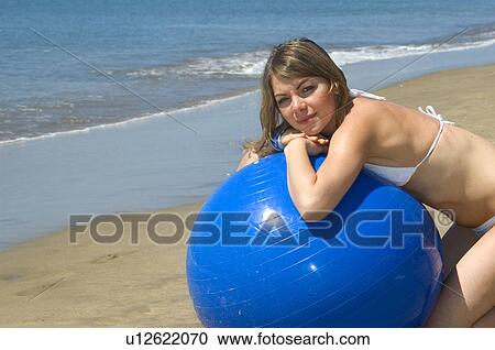 Stock Image - Woman, Blond, Blonde, Blond hair, Beauty, Beach, Summer. Fotosearch