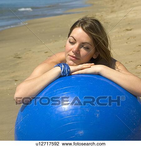Stock Image - Woman, Blond, Blonde, Blond hair, Beauty, Beach, Summer. Fotosearch