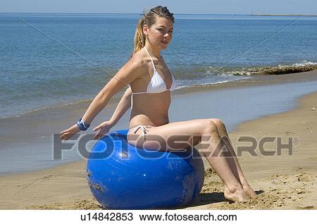 Stock Image - Woman, Blond, Blonde, Blond hair, Beauty, Beach, Summer. Fotosearch