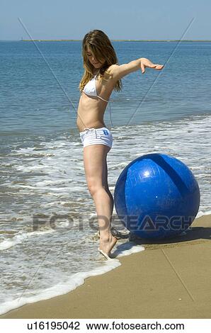 Stock Image - Woman, Blond, Blonde, Blond hair, Beauty, Beach, Summer. Fotosearch