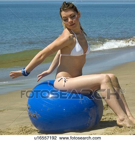 Stock Image - Woman, Blond, Blonde, Blond hair, Beauty, Beach, Summer. Fotosearch