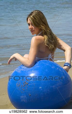 Stock Image - Woman, Blond, Blonde, Blond hair, Beauty, Beach, Summer. Fotosearch