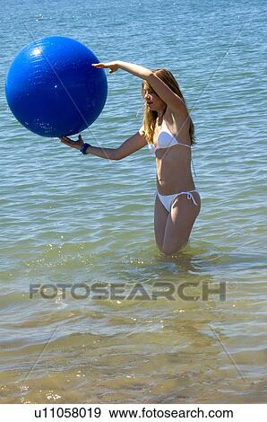 Stock Photo - Woman, Blond, Blonde, Blond hair, Beauty, Beach, Summer. Fotosearch