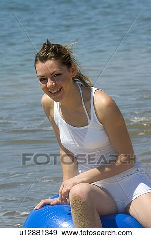 Stock Photo - Woman, Blond, Blonde, Blond hair, Beauty, Beach, Summer. Fotosearch