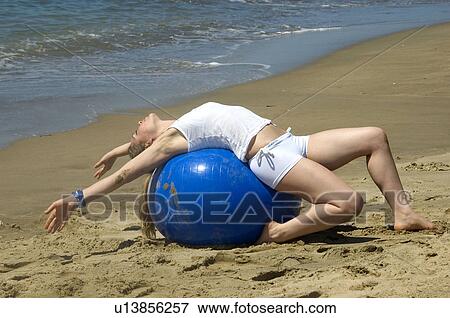 Stock Photo - Woman, Blond, Blonde, Blond hair, Beauty, Beach, Summer. Fotosearch