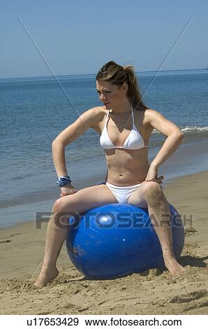 Stock Photo - Woman, Blond, Blonde, Blond hair, Beauty, Beach, Summer. Fotosearch
