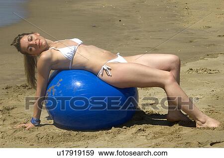 Stock Photo - Woman, Blond, Blonde, Blond hair, Beauty, Beach, Summer. Fotosearch