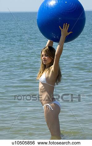 Stock Photograph - Woman, Blond, Blonde, Blond hair, Beauty, Beach, Summer. Fotosearch