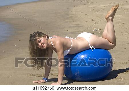 Stock Photograph - Woman, Blond, Blonde, Blond hair, Beauty, Beach, Summer. Fotosearch
