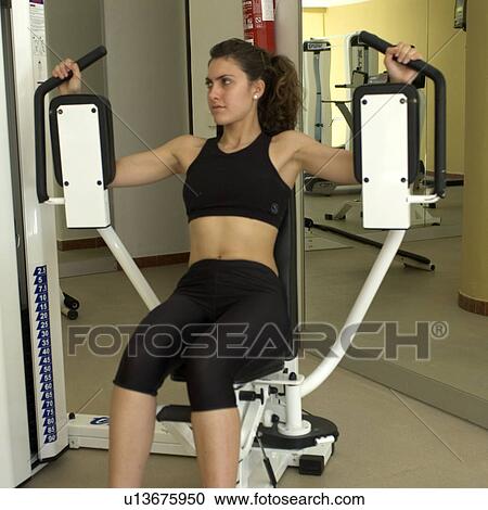 Stock Image - Woman, Fitness, Gym, Gymnastics, Brown hair, Pigtail, Ponytail. Fotosearch