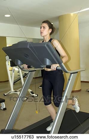 Stock Image - Woman, Fitness, Gym, Gymnastics, Brown hair, Pigtail, Ponytail. Fotosearch