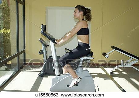Stock Image - Woman, Fitness, Gym, Gymnastics, Brown hair, Pigtail, Ponytail. Fotosearch