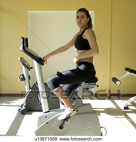 Stock Photo - Woman, Fitness, Gym, Gymnastics, Brown hair, Pigtail, Ponytail. Fotosearch