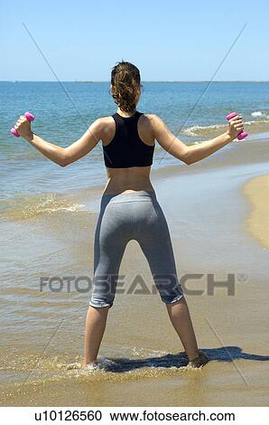 Stock Image - Woman, Fitness, Gymnastics, Brown hair, Pigtail, Ponytail, Long hair. Fotosearch
