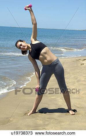 Stock Image - Woman, Fitness, Gymnastics, Brown hair, Pigtail, Ponytail, Long hair. Fotosearch