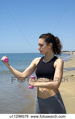Stock Photo - Woman, Fitness, Gymnastics, Brown hair, Pigtail, Ponytail, Long hair. Fotosearch