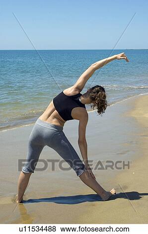 Stock Photo - Woman, Fitness, Gymnastics, Brown hair, Pigtail, Ponytail, Long hair. Fotosearch