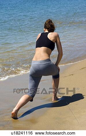 Stock Photograph - Woman, Fitness, Gymnastics, Brown hair, Pigtail, Ponytail, Long hair. Fotosearch
