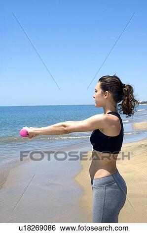 Stock Photograph - Woman, Fitness, Gymnastics, Brown hair, Pigtail, Ponytail, Long hair. Fotosearch