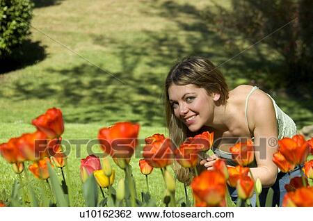 Stock Image - Woman, Young, Nature, Country, Flowers, Beauty, Blond. Fotosearch