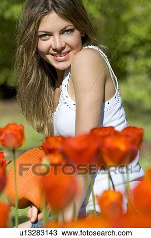 Stock Image - Woman, Young, Nature, Country, Flowers, Beauty, Blond. Fotosearch