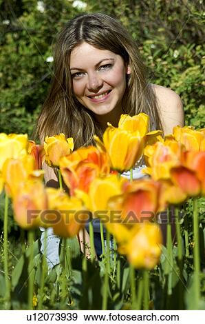 Stock Photo - Woman, Young, Nature, Country, Flowers, Beauty, Blond. Fotosearch