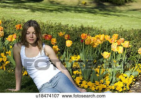 Stock Photo - Woman, Young, Nature, Country, Flowers, Beauty, Blond. Fotosearch