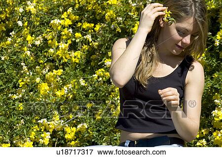 Stock Photo - Woman, Young, Nature, Country, Flowers, Beauty, Blond. Fotosearch