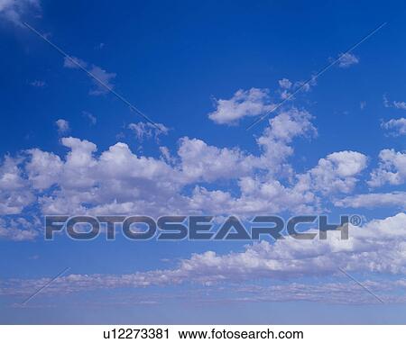 Stock Image - Clouds In Blue Sky. Fotosearch