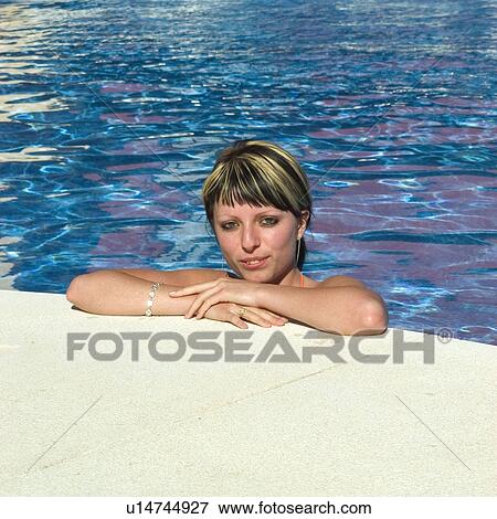 Woman, Beauty, Young, Face, Smiling, Brown Hair, Swimming Pool View Large Photo Image Stock Photo - Woman, Beauty, Young, Face, Smiling, Brown Hair, Swimming Pool. Fotosearch