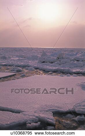 Stock Photography - Drift Ice And The Morning Sun. Fotosearch