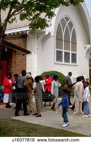 Stock Photo - Church congregation headed in for worship service. Fotosearch